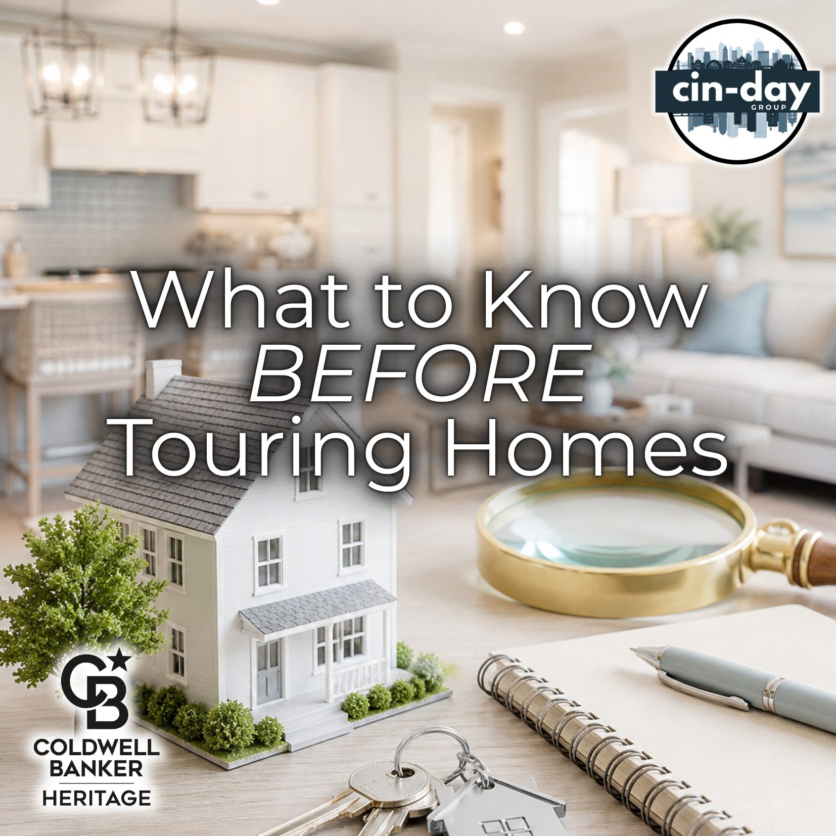 A bright, modern real estate themed graphic featuring a model home, house keys, a magnifying glass, and a notebook on a table with a softly blurred contemporary home interior in the background. Overlay text reads "What to Know BEFORE Touring Homes," with Cin-Day Group and Coldwell Banker Heritage logos in opposite corners.